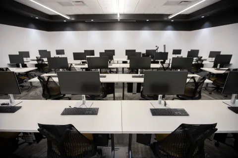 An empty classroom full of computers