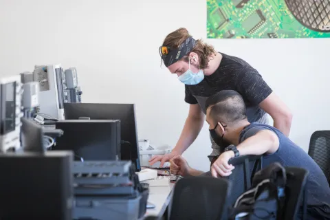 Two Students working on computer repair
